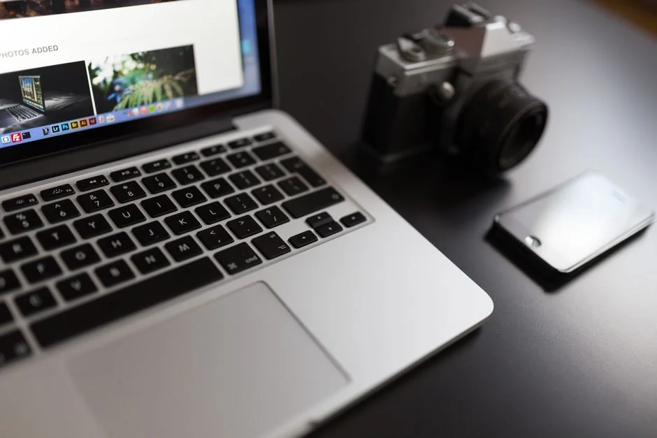 A person using a laptop to browse stock photo websites. Freelancing work in a cozy setting.